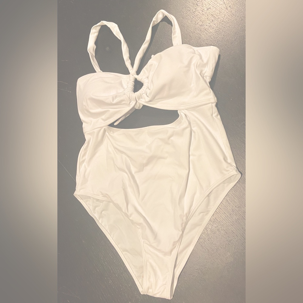 White one piece tie-back bathing suit. Moderate coverage. Size large.